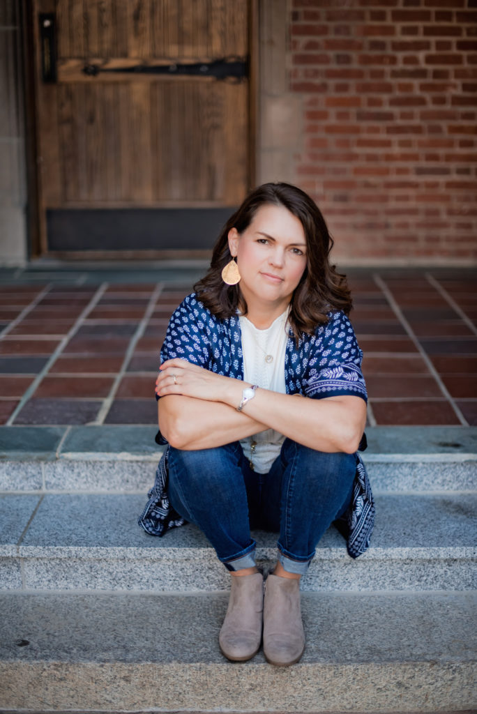 A picture of me sitting on steps, smiling a little. I'm looking very calm. So unlike me.